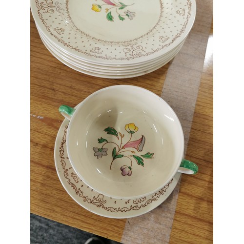 32 - A hand painted Clarice Cliff Royal Staffordshire pottery AJ.Wilkinson comprehensive dinner set to in... 