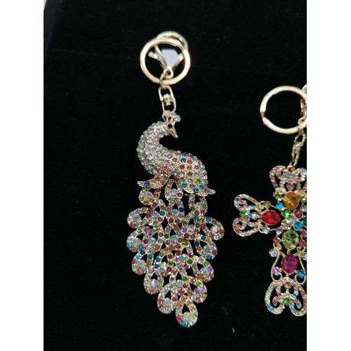 50 - Bright and sparkley bag charm keyrings with colourful glass stones including a peacock, dolphin and ... 