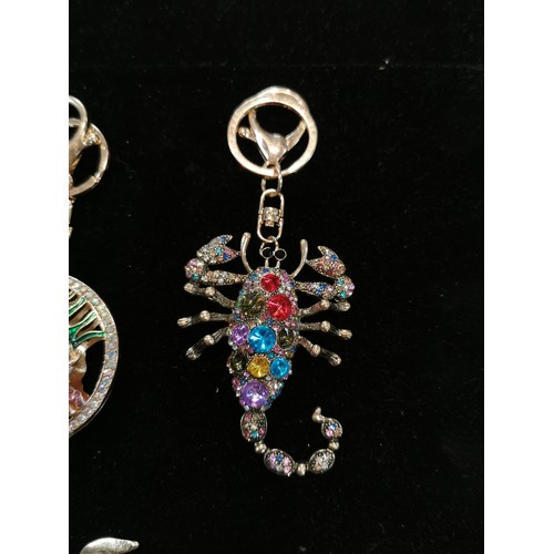 50 - Bright and sparkley bag charm keyrings with colourful glass stones including a peacock, dolphin and ... 