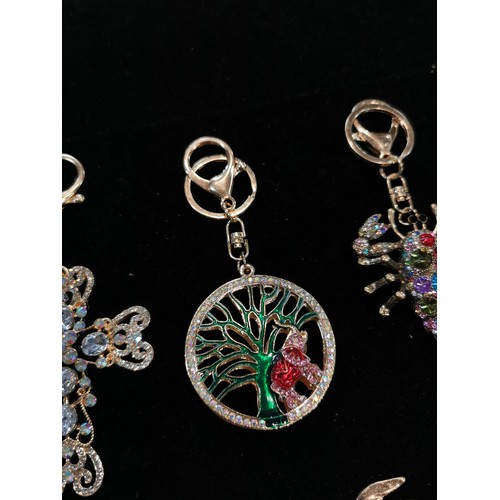 50 - Bright and sparkley bag charm keyrings with colourful glass stones including a peacock, dolphin and ... 