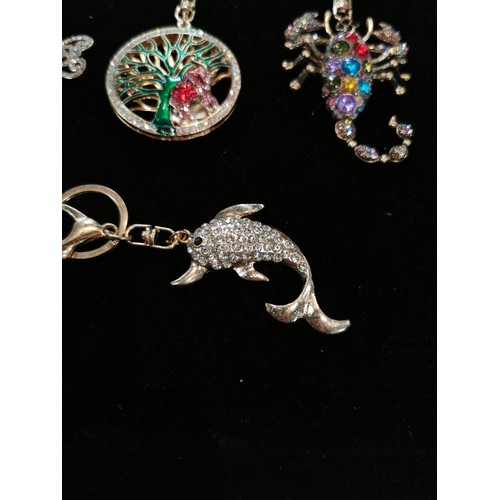 50 - Bright and sparkley bag charm keyrings with colourful glass stones including a peacock, dolphin and ... 