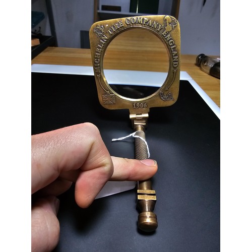 199 - An antique brass advertising magnifying glass for Michelin tyre company dated 1906, the magnifying g... 