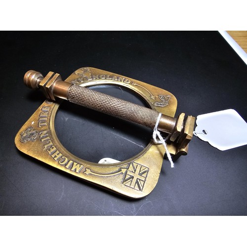 199 - An antique brass advertising magnifying glass for Michelin tyre company dated 1906, the magnifying g... 