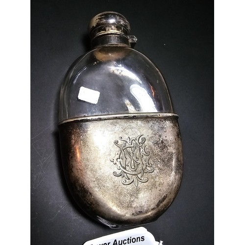 205 - An antique hip flask with a silver plated top and base, in good condition, has a length of 13cm, wit... 