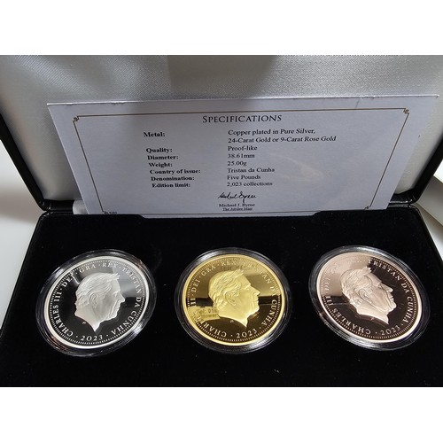 126 - An as new cased Jubilee mint The King Charles III £5 Laurel coin collection, to include three £5 coi... 