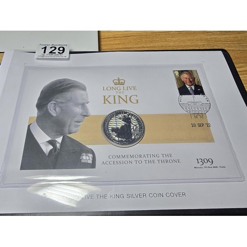 129 - A Westminster collection Long Live The King silver coin cover which includes a stamped cover of one ... 