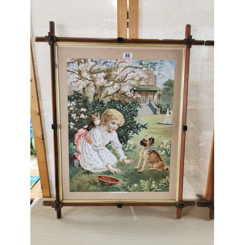 86 - 2x framed prints (one is glazed), one of the prints is of a girl playing with her dog and kitten in ... 