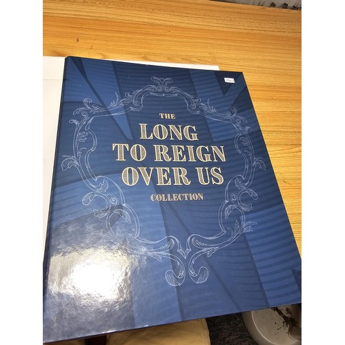 131 - The Westminster collection The Long to reign over us 50p coin collection complete with its collector... 