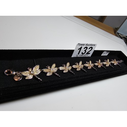 132 - An as new unused 925 silver bracelet with a dragonfly design, each dragonfly is inset with a crystal... 