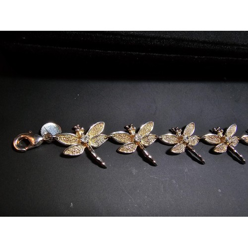 132 - An as new unused 925 silver bracelet with a dragonfly design, each dragonfly is inset with a crystal... 