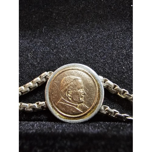 133 - A vintage 925 silver double strand bracelet inset with a real 14ct gold Pope John Paul II coin in ex... 