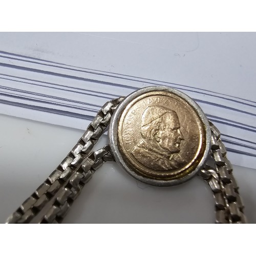 133 - A vintage 925 silver double strand bracelet inset with a real 14ct gold Pope John Paul II coin in ex... 