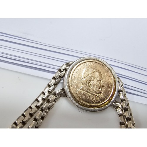 133 - A vintage 925 silver double strand bracelet inset with a real 14ct gold Pope John Paul II coin in ex... 