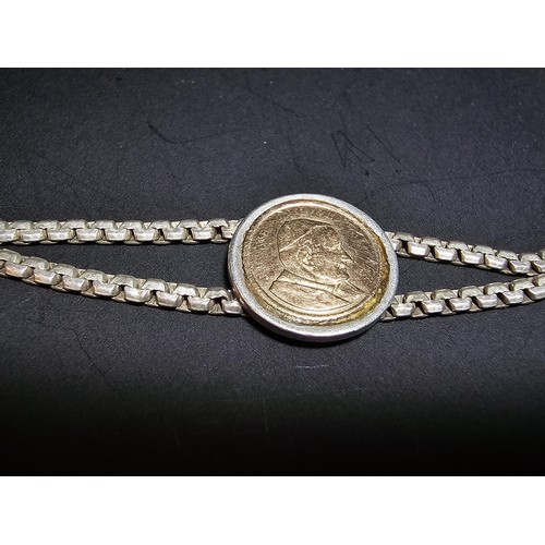 133 - A vintage 925 silver double strand bracelet inset with a real 14ct gold Pope John Paul II coin in ex... 