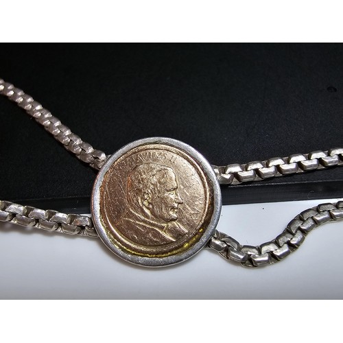 133 - A vintage 925 silver double strand bracelet inset with a real 14ct gold Pope John Paul II coin in ex... 