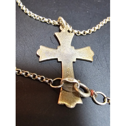 140 - A 925 silver cross pendant on an 18