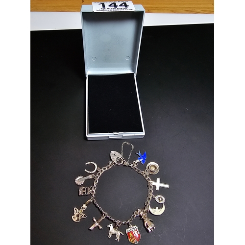 144 - A good 925 silver charm bracelet with 13x different silver charms and 925 silver padlock clasp with ... 