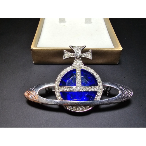 150 - A Vivienne Westwood style blue orb and cross jeweled brooch, displays well, In excellent clean condi... 