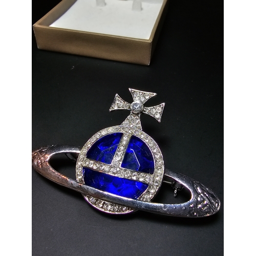 150 - A Vivienne Westwood style blue orb and cross jeweled brooch, displays well, In excellent clean condi... 