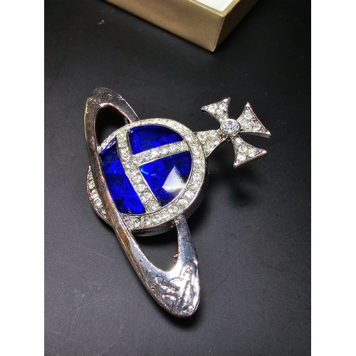 150 - A Vivienne Westwood style blue orb and cross jeweled brooch, displays well, In excellent clean condi... 