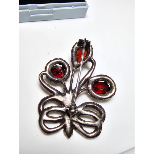 153 - A good quality vintage sterling silver brooch in the form of flowers inset with 3x large faceted nat... 