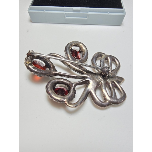 153 - A good quality vintage sterling silver brooch in the form of flowers inset with 3x large faceted nat... 