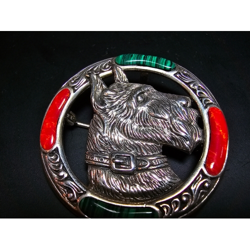 154 - A stunning 925 silver Celtic brooch / pendant featuring a well detailed Scottie dog's head to the ce... 