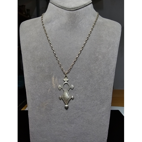 156 - A good quality 925 silver necklace which features a hand crafted sterling silver drop pendant on a g... 