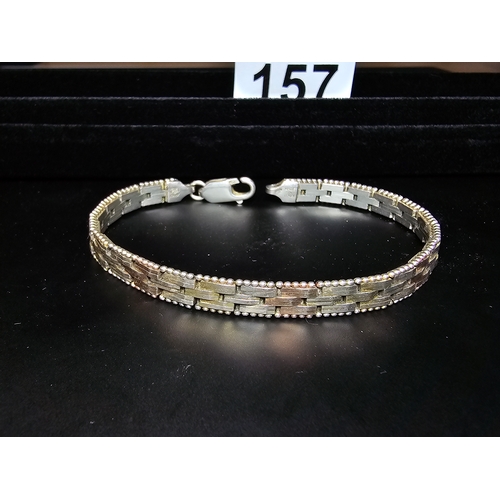 157 - A 925 silver tri-colour bracelet featuring rose gold and yellow gold plated links, In good clean con... 