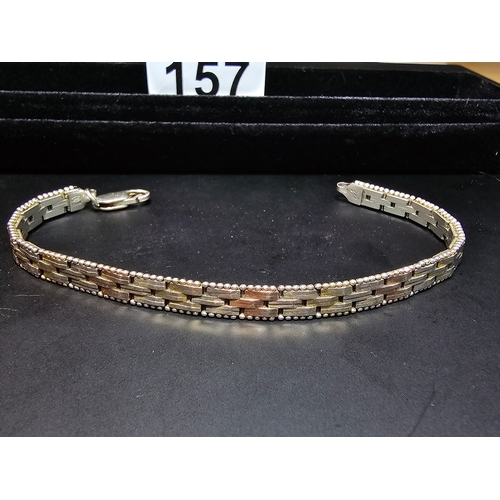 157 - A 925 silver tri-colour bracelet featuring rose gold and yellow gold plated links, In good clean con... 