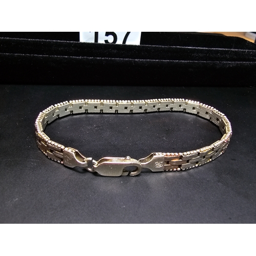 157 - A 925 silver tri-colour bracelet featuring rose gold and yellow gold plated links, In good clean con... 