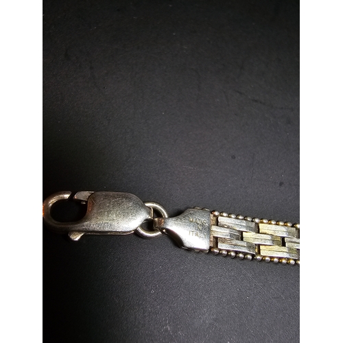 157 - A 925 silver tri-colour bracelet featuring rose gold and yellow gold plated links, In good clean con... 