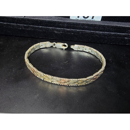 157 - A 925 silver tri-colour bracelet featuring rose gold and yellow gold plated links, In good clean con... 