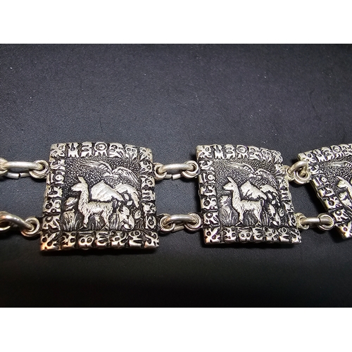 158 - A good foreign vintage .800 solid silver panel bracelet featuring an Alpaca and Eagle scene to each ... 