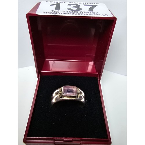 137 - A chunky 925 silver ring inset with a faceted natural amethyst gemstone, in excellent clean conditio... 