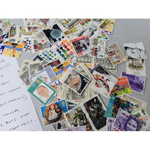 99 - Large quantity of loose British commemorative stamps collected over many years, most are used with a... 