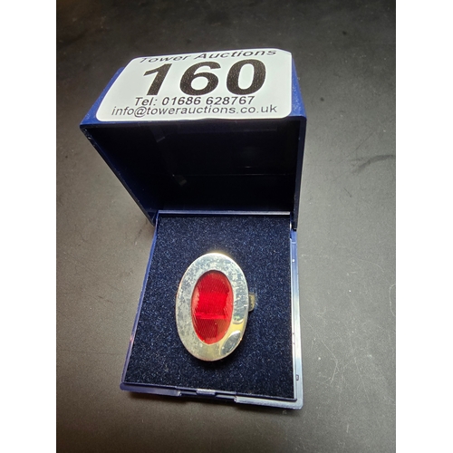 160 - 925 Silver chunky ring inset with a red glass panel, in good order, size L, complete with presentati... 