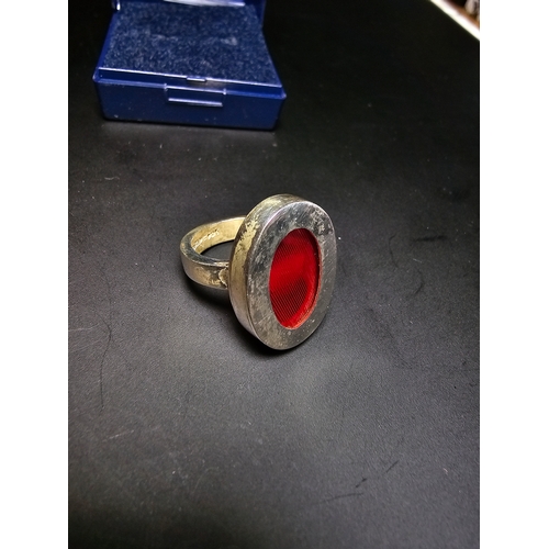 160 - 925 Silver chunky ring inset with a red glass panel, in good order, size L, complete with presentati... 