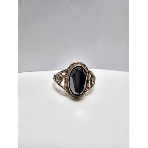 161 - 925 Silver ring inset with a large faceted marcasite stone, size J, in good clean condition complete... 