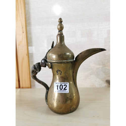 102 - Rare antique Middle Eastern Arabic brass Dallah coffee pot, animal hide can still be seen on the han... 