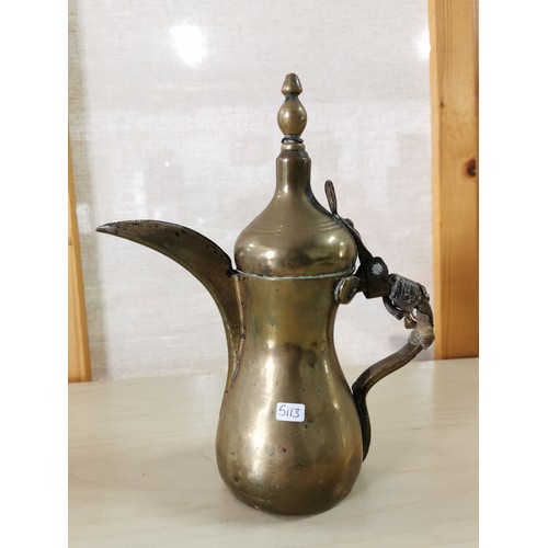 102 - Rare antique Middle Eastern Arabic brass Dallah coffee pot, animal hide can still be seen on the han... 