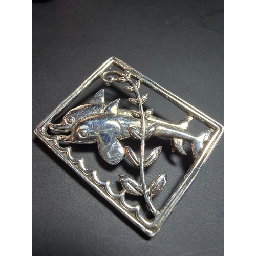 166 - An as new unused Danish Sterling Silver Brooch with a dolphin design, marked Sterling Denmark to the... 