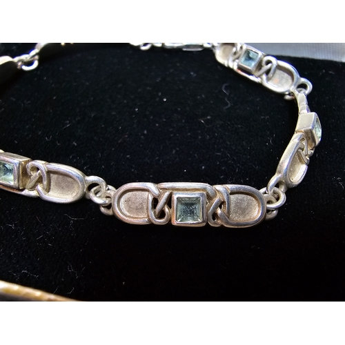 176 - A good 925 silver panel bracelet by Rennie Mackintosh collection, inset with blie topaz stones, in g... 