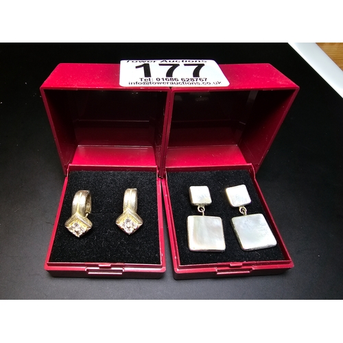 177 - Bundle of 2x boxed pairs of 925 silver earrings to include a good drop pair inset with mother of pea... 