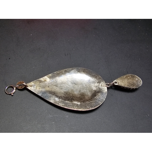 183 - A good quality 925 silver large drop pendant with a handworked intricate design, inset with a natura... 