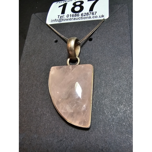 187 - 925 Silver pendant inset with a large rose quartz stone, set on a 18