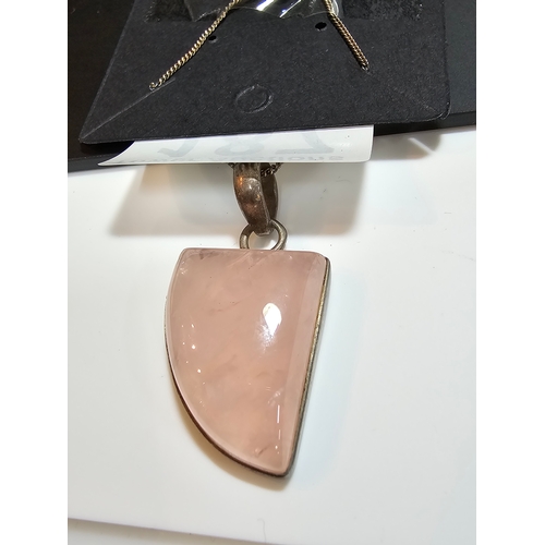 187 - 925 Silver pendant inset with a large rose quartz stone, set on a 18