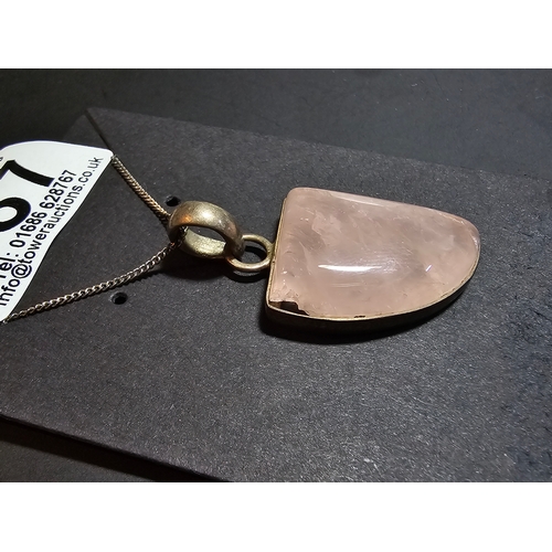 187 - 925 Silver pendant inset with a large rose quartz stone, set on a 18