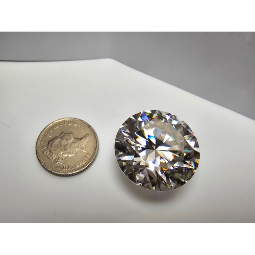 231 - A stunning very rare and large 30ct Belgian Cut Clear Moissanite Diamond with a diameter of 20mm wit... 