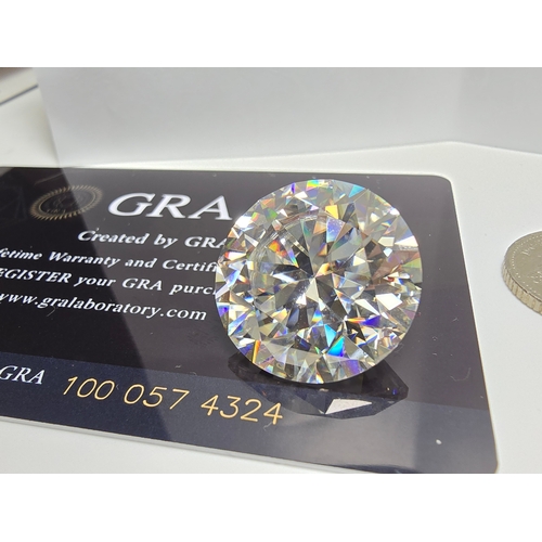 231 - A stunning very rare and large 30ct Belgian Cut Clear Moissanite Diamond with a diameter of 20mm wit... 